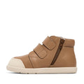 The Pretty Braver Blake Leather Boot First Walker Tan is a tan hi-top with two velcro straps, side zipper, white rubber sole, reinforced stitching, and rounded toe. Displayed on a plain white background., 9420075329140, 9420075329133, 9420075329126