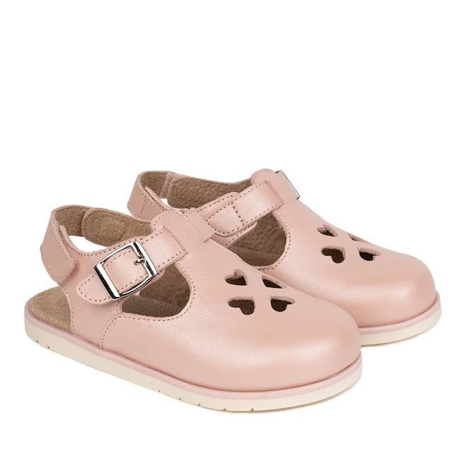 Pretty Brave Clara Closed Toe Sandal Blush Pearl Pink: premium leather kids’ sandals in light pink with buckle straps and floral cut-outs, shown on a white background.