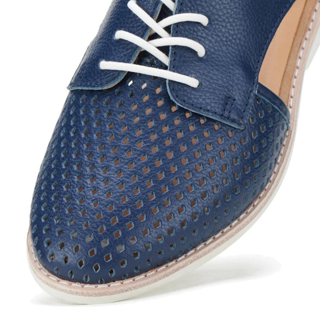Close-up of the toe and upper of the Rollie Womens Sidecut Punch Navy Tumble Leather Shoe, featuring white laces, punch hole details on the front, a textured navy leather finish, and a light-colored stitched sole for comfort and style., 9781760775414, 9781760775421, 9781760775438, 9781760775445, 9781760775452