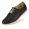 The Rollie Derby Applique Black Womens Leather Brogue Shoe features soft black leather uppers, decorative cutouts, a flower-shaped appliqué, white laces, and a white rubber sole—an Australian-designed classic.