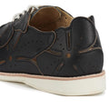 A close-up of the Rollie Derby Applique Black Womens Leather Brogue Shoe shows black leather uppers with floral-shaped perforations, overlays, a white sole, and tan interior lining., 9781760792312, 9781760792329, 9781760792336, 9781760792343, 9781760792350