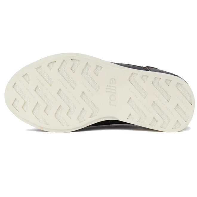 The image shows the white, textured sole of the Rollie Derby Applique Black Womens Leather Brogue Shoe with "rollie" embossed near the center. The Australian-designed sole features a zigzag traction pattern for grip., 9781760792312, 9781760792329, 9781760792336, 9781760792343, 9781760792350