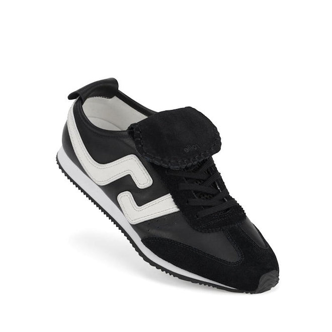 The Rollie Womens Shift Black/Bone Sneaker, model PS00093, stands out with a wavy white side stripe, black suede accents, and a distinctive black flap over the laces, all presented on a crisp white background.