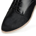 Close-up of the Rollie Womens Derby Black Splice Leather Brogue Shoe, showcasing smooth leather with a textured finish, anti-slip rubber outsole, black laces, and contrast stitching along the sole., 51190, 9339554014920, 9339554054292, 9339554007458, 9339554000329, 9339554389769