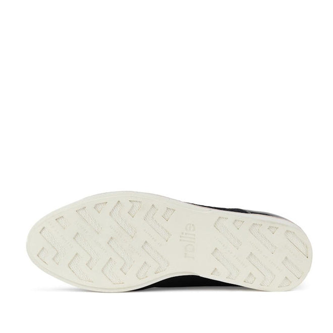 The image displays the white anti-slip rubber outsole of the Rollie Womens Derby Black Splice Leather Brogue Shoe, featuring a zigzag and geometric texture with "rollie" embossed near the arch. The background is white., 51190, 9339554014920, 9339554054292, 9339554007458, 9339554000329, 9339554389769