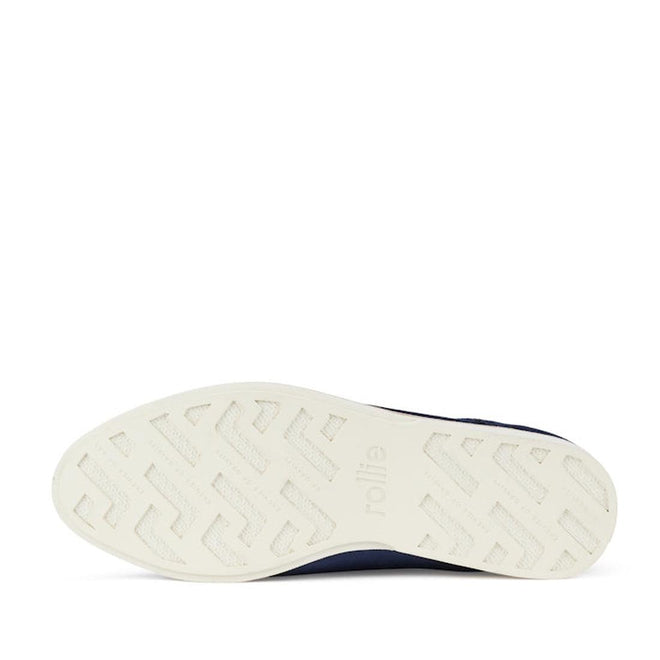 The image displays the white textured sole with a geometric pattern, "rollie" embossed, and code SC02100, from the Rollie Womens Derby Navy Velvet Brogue Shoe., 9339554000046, 9339554035741, 9339554028743, 9339554006123, 9339554009810