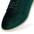 Close-up of the toe and laces of the Rollie Womens Derby Emerald Velvet Brogue Shoe, featuring dark green velvet, a light tan sole, white stitching, a smooth soft texture, and neatly tied laces., 9339554068114, 9339554005690, 9339554000077, 9339554000336, 9339554023830