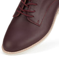 Close-up of the Rollie Womens Derby Super Soft Dark Cherry Leather Shoe, featuring matching dark red laces, red stitching, and a cream rubber sole with an anti-slip outsole against a white background., 9339554034843, 9339554086330, 9339554099231, 9339554070285, 9339554124001, 9339554126029