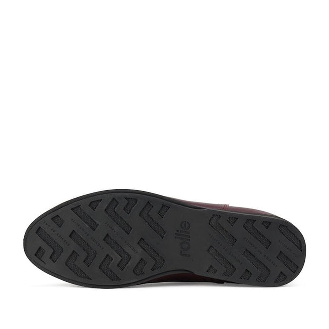 The image shows the black rubber sole of the Rollie Womens Chelsea Dark Cherry Leather Ankle Boot, featuring a textured geometric tread and "rollie" embossed near the center, with style code SC02136 for identification., 9339554019543, 9339554104898, 9339554094687, 9339554000190, 9339554073989