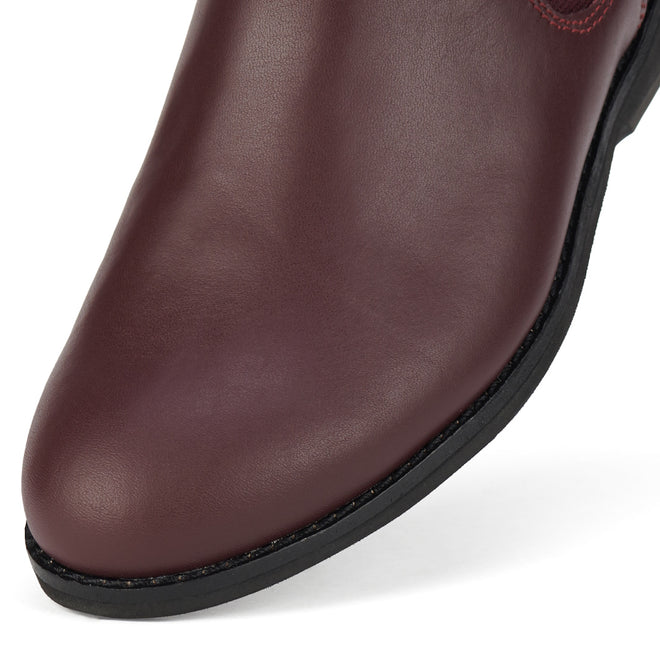 Close-up of the toe and sole of the Rollie Womens Chelsea Dark Cherry Leather Ankle Boot, featuring smooth leather texture, black trim, and detailed stitching that highlight its elegant design and exceptional craftsmanship., 9339554019543, 9339554104898, 9339554094687, 9339554000190, 9339554073989