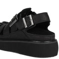 Heel view showing back strap with buckle of Rollie Hyde Fisherman Black sandal with buckle detail on a white background.,
9781760788858,
9781760788865,
9781760788872,
9781760788889,
9781760788896,