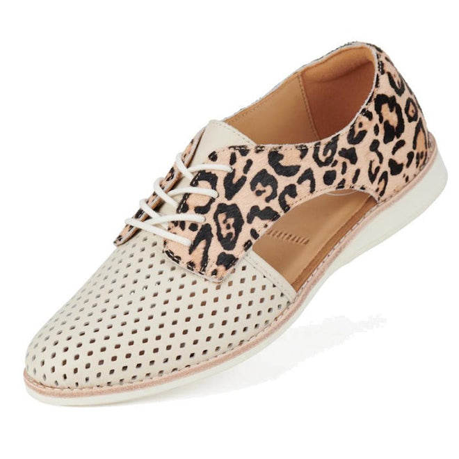 The Rollie Womens Sidecut Punch Bone Leather Leopard Cut Out Brogue is a stylish oxford with beige punch hole detail, pony hair leopard print accents, tan sole, cut-outs, and beige laces.
