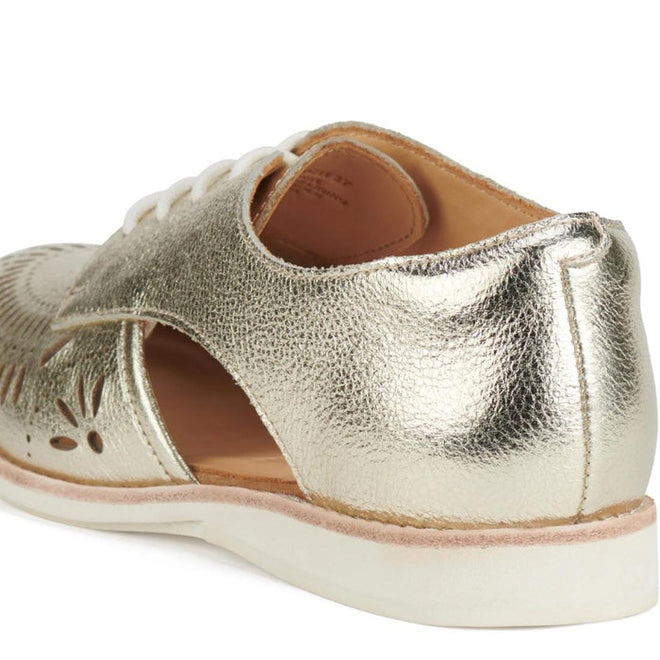 A close-up of the Rollie Womens Sidecut Boho Punch Gold Leather Shoe shows its metallic gold textured leather, floral cut-outs, white laces and sole, memory foam footbed, and a light tan inner lining for added comfort., 9381760798811, 9381760798828, 9381760798835, 9381760798842, 9381760798859