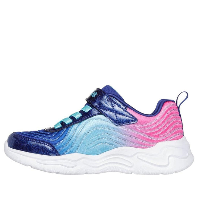 The Skechers Girls Light Ups - Wavy Beams Ombre Express Navy Multi features a vibrant ombre wavy design in blue, turquoise, and pink, a blue strap with laces, and a thick white textured sole—ideal for fans of light-up trainers., 44516, 197976390843, 197976390867, 44519, 44520, 44521