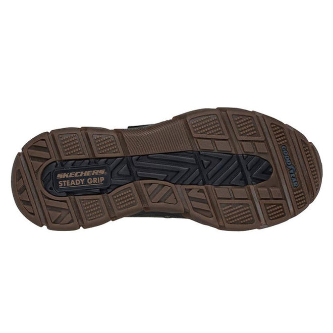 The image shows the brown and black treaded sole of Skechers John Deere Waterproof Respected Swamper Boots Olive Brown Slip Ins, labeled SKECHERS STEADY GRIP and GOODYEAR, highlighting a durable, slip-resistant design., 50410, 198376036836, 198376036850, 198376036874, 198376036898