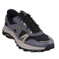 The Skechers John Deere Equalizer 5.0 Trail Harvester Slip Ins in grey, charcoal, and black features a rugged sole, yellow accents, side and tongue branding, mesh/synthetic upper, and Air-Cooled Memory Foam for all-terrain comfort.
