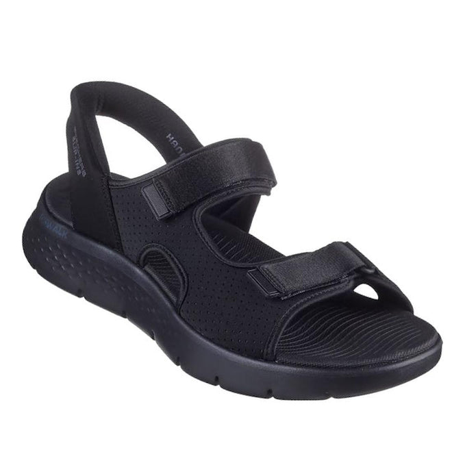 A black Skechers Mens Go Walk Flex SD Easy Entry Slip In Sandals, featuring two adjustable Velcro straps, an open toe, and a thick textured sole for comfort. Inspired by sporty, casual men’s slip-in sandal styles.