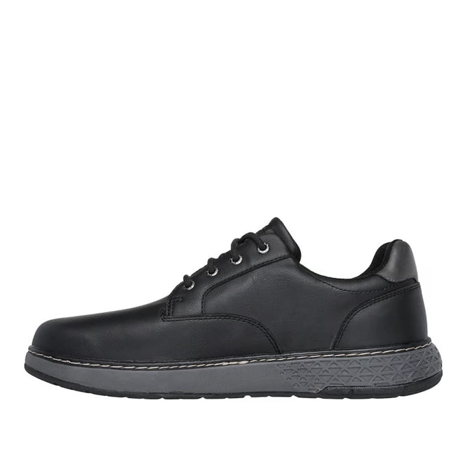 Introducing the Skechers Men’s EXTRA Wide Width Garlan Pryor Waterproof Slip-On Trainer in Black—a streamlined trainer crafted from waterproof materials with a generous extra-wide fit. This low-cut design features a sleek black upper with subtle stitching accents, complemented by a padded collar for comfort and support. A thick, textured gray sole ensures durability and traction, seamlessly blending modern style with everyday performance., 53093, 53094, 198739933048, 198739933062, 53097