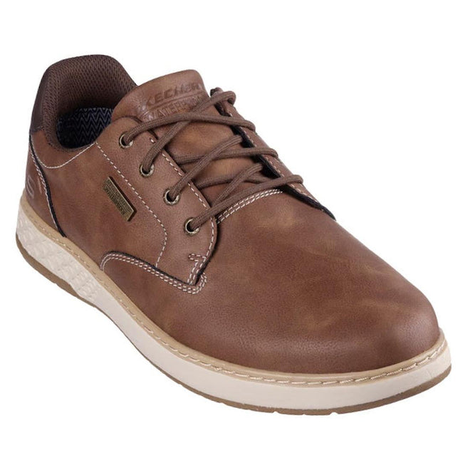 The Skechers Mens Wide Width Garlan Pryor Waterproof Slip on Trainer in brown features smooth vegan leather, white stitching, and a light beige textured sole. This low-top shoe provides comfort and style for those who need extra wide width footwear.