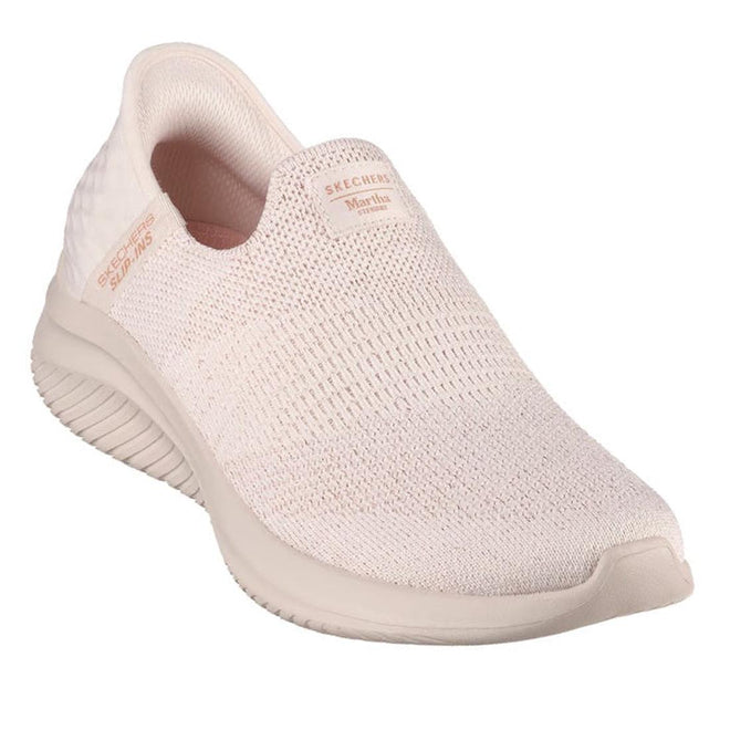 Pink slip-on shoe with 'Skechers' branding on a white background