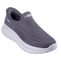 The Skechers Womens Slip In Go Walk Arch Fit N-Joy in Dark Mauve is a vegan slip-on athletic shoe featuring a knit mesh upper, white cushioned sole, and subtle light pink accents.