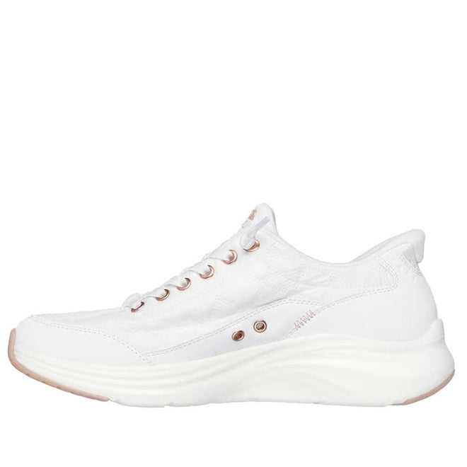 The Skechers Womens Slip In Contour Foam Golden Hour Cozy Fit in White Rose Gold is a white athletic shoe with a cushioned sole, rose gold eyelets, and Air-Cooled Memory Foam, shown in side profile on a plain white background., 49547, 198739849509, 198739849523, 198739849530, 198739849547, 198739849554, 198739849561, 198739849585, 198739849592