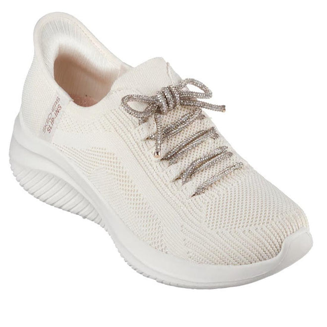 The Skechers Womens Slip-ins Ultra Flex 3.0 - Diamond Dreamer Natural Gold is a white knit athletic sneaker with a textured sole, silver laces, and Air-Cooled Memory Foam, shown from a front-side angle on a plain white background.