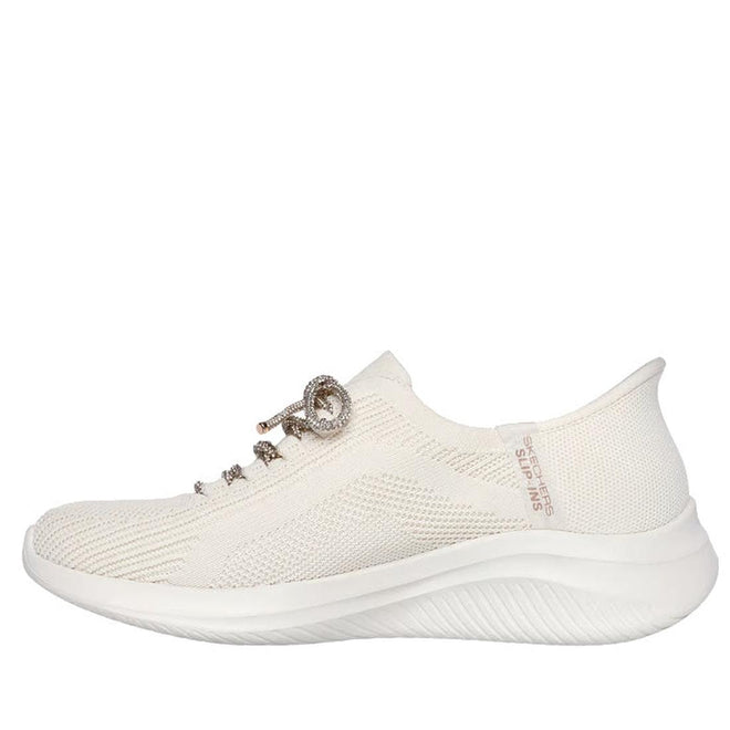 A side view of the Skechers Womens Slip-ins Ultra Flex 3.0 - Diamond Dreamer Natural Gold, showcasing a textured knit upper, decorative laces, thick curved sole, Hands Free Slip-ins design, Air-Cooled Memory Foam, and branding near the heel., 198376643225, 50148, 198376643249, 50150, 198376643263, 50152, 50153, 50154