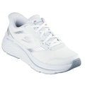 The Skechers Slip In Max Cushioning Elite 2.0 Leigh White Trainer features a mesh upper with silver accents, lace-up closure, thick cushioned sole, Air-Cooled Memory Foam, Skechers S logo on the side, and Max Cushioning Elite text near the heel.
