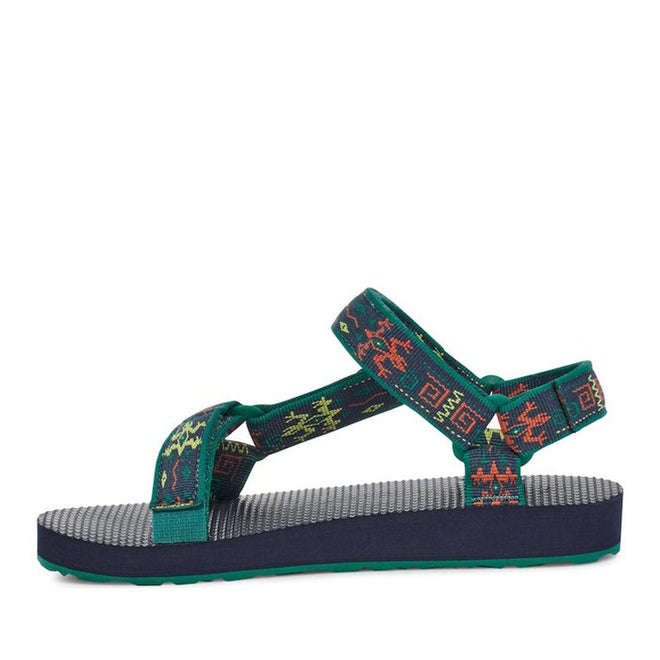 The Teva Kids K Original Universal C Gecko Navy Green is a single water sandal with a navy sole, gray textured footbed, and green straps featuring red, yellow, and orange geometric patterns. It has an open toe and adjustable hook-and-loop closures at the ankle and heel., 196565105097, 196565105035, 196565105042, 196565105059, 196565105066, 196565104960, 196565104977, 196565104984, 31473