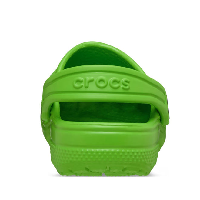 A Crocs Kids - Classic Clog Bright Green for juniors is shown from the back, highlighting the heel strap with "crocs" embossed and the textured sole. The water-friendly shoes are set against a plain white background., 49828, 49829, 49830, 49831, 49832, 49833, 49834, 49835, 49836