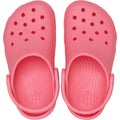 A pair of Crocs Kids Youths - Classic Clog K Guava Pink water-friendly clogs with ventilation holes and adjustable heel straps, viewed from above., 49837, 49838, 49839, 49840, 49841, 49842, 49843, 49844, 49845