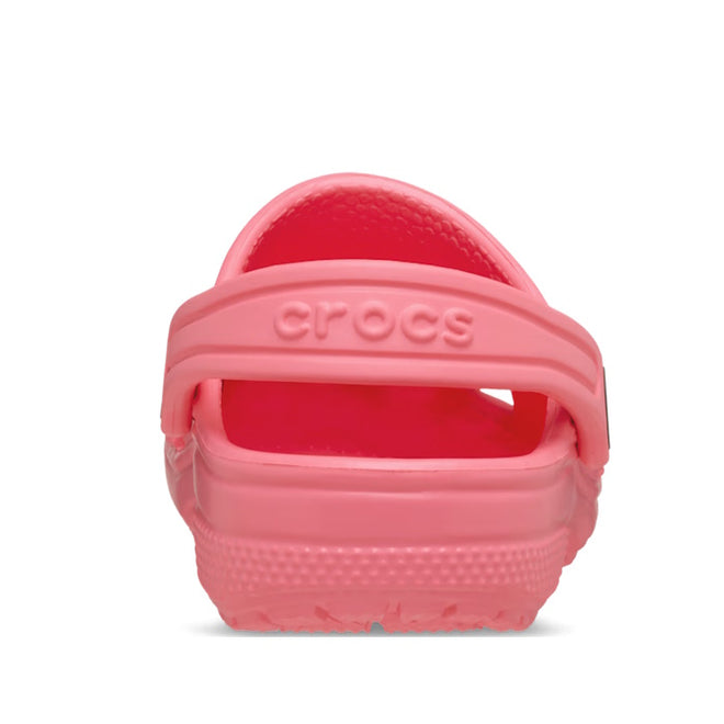 A rear view of the Crocs Kids Youths - Classic Clog K Guava Pink shows the heel strap with embossed crocs logo. These water-friendly clogs offer a ventilated slip-on design, perfect for all-day comfort., 49837, 49838, 49839, 49840, 49841, 49842, 49843, 49844, 49845