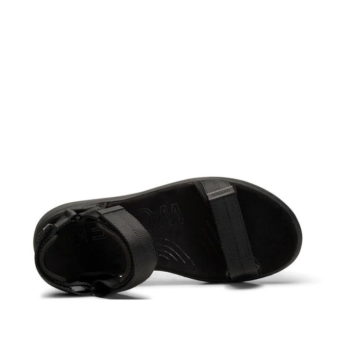 The Woden Line Women's 3 Strap Sandal Black is a minimalist, flat black sandal seen from above, with adjustable ankle buckle and toe strap. The brand is subtly embossed on the footbed for added style and comfort., 5713326456912, 5713326456929, 5713326456936, 5713326456943, 5713326456950, 5713326456967, 5713326456974