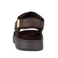 Rear view of the Woden Line Women's 3 Strap Sandal in chocolate brown, featuring adjustable straps, a thick sole with Natural Soft technology, and a fabric label on the left heel strap, set against a white background., 48196, 5713326592511, 5713326592528, 5713326592535, 5713326592542, 5713326592559, 5713326592566