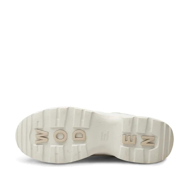 The image shows the chunky sole of the Woden SIF Reflective Women's Sneaker in Blanc de Blanc White, featuring raised, blocky "WODEN" lettering and deep grooves for traction. Made with recycled polyester for durability., 36107, 5713326428612, 5713326428629, 5713326428636, 36110
