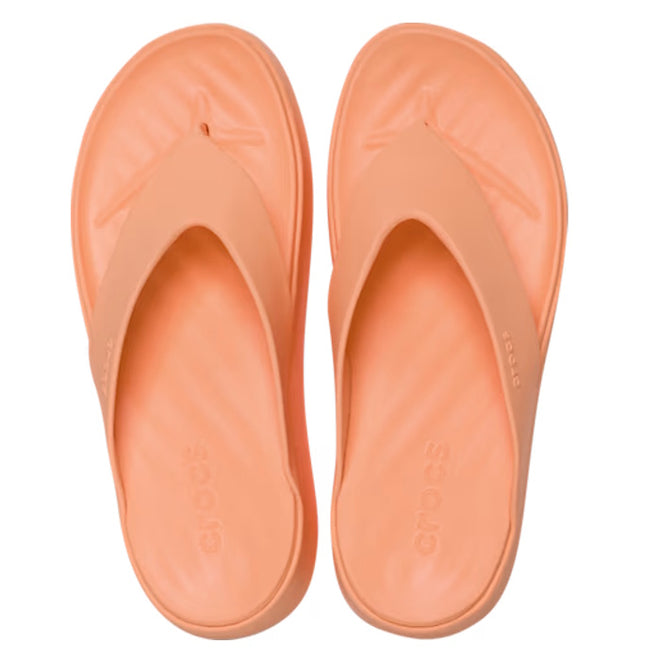 The Crocs Womens Getaway PLATFORM Flip Sandal in Sunstone Orange features wide straps, cushioned soles with Free Feel Technology, and a platform jandal style, shown here as a peach-colored slip-on viewed from above., 49910, 49911, 198445274329, 198445274336, 198445274343, 49915, 49916
