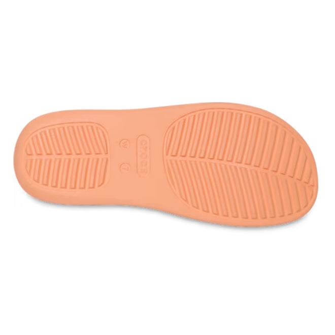 The image shows the sole of the Crocs - Womens Getaway PLATFORM Flip Sandal in Sunstone Orange, highlighting two tread patterns, Free Feel Technology, and the Crocs brand name embossed at the center., 49910, 49911, 198445274329, 198445274336, 198445274343, 49915, 49916