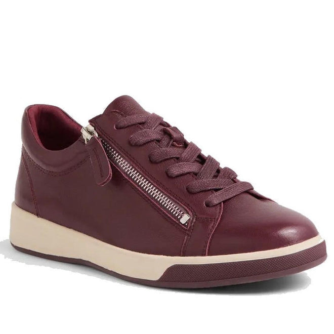 The Ziera Aito XF Women's Casual Sneaker Zip in Burgundy features maroon leather, matching laces, a side zipper, a white rubber sole, and an extra wide fit for stylish everyday comfort.