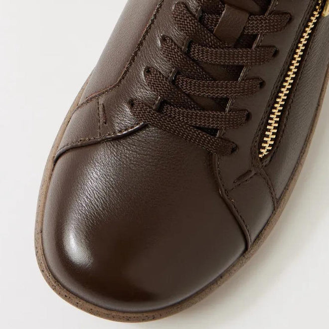 Close-up of the toe and laces of the Ziera Solar XW Women's Casual Sneaker in chocolate brown leather, featuring high arch support and a gold side zipper detail, shown against a light background., 51019, 44347555285581, 4434755525604, 4434755525628, 4434755525642, 4434755525666, 4434755525673