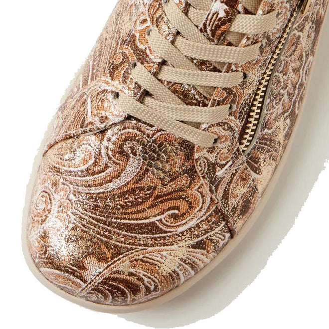 A close-up of the Ziera Solar XW Women's Casual Sneaker in Chocolate Gold Paisley highlights its brown textured leather, ornate gold swirl pattern, high arch support, and side gold zipper., 51033, 4434755528438, 4434755528452, 4434755528476, 4434755528490, 4434755528513, 4434755528520
