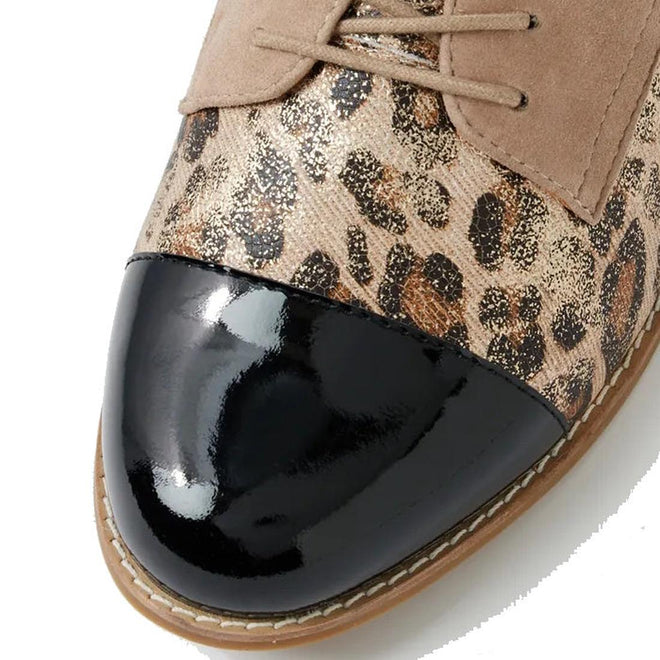 Close-up of the Ziera Tobin XF Women's Flat Brogue in Black Taupe Leopard: features a glossy black toe cap, leopard print leather, beige suede laces and panels, visible stitching on the brown rubber sole, and an extra wide fit for comfort., 51040, 4434755462978, 4434755462985, 4434755462992, 4434755463005, 4434755463012, 4434755463029