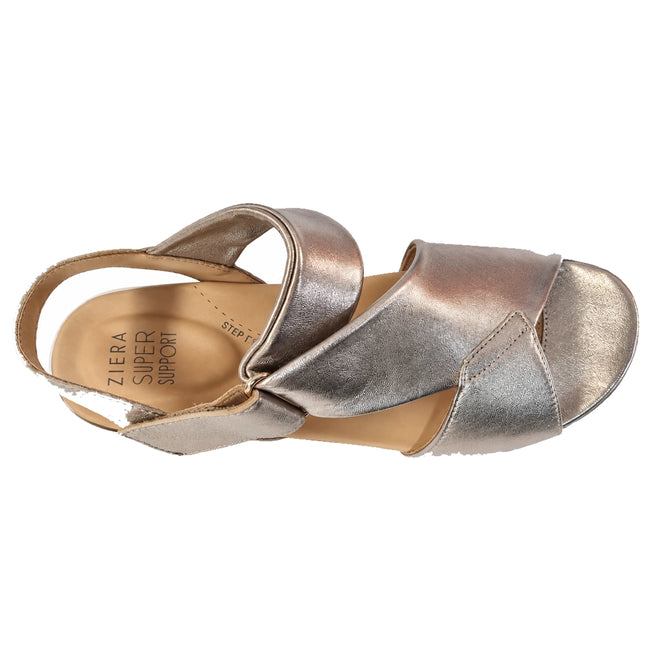Ziera Nazly2 Platino Gold White XW Women’s Leather Sandal featuring metallic gold and white leather, wide crisscross straps, a closed back, and an adjustable Velcro ankle strap. The insole displays “Ziera Super Support,” providing high arch support and a cushioned sole for comfort.