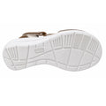The image displays the white grooved sole of the Ziera Nazly2 Platino Gold White XW Womens Leather Sandal, viewed from underneath to highlight its tread pattern and the embossed Ziera branding at the center. This distinctive sole design offers excellent traction and features high arch support, enhancing overall comfort for the wearer.
