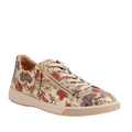 The Ziera Aito XF Women’s Casual Sneaker Zip Red Floral Print features beige leather with red and blue floral patterns, beige laces, and a convenient side zipper. Displayed on a white background, these sneakers are designed with high arch support for added comfort throughout the day.