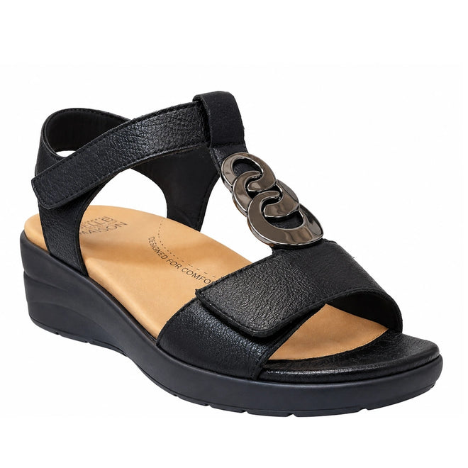 Experience all-day comfort and style with the Ziera Navvon Black XW Womens Leather Slingback Sandal—this black open-toe wedge features a thick heel strap, a metallic chain accent on the upper, and a tan cushioned insole. Crafted from casual leather with excellent arch support, these wedges are perfect for everyday wear.