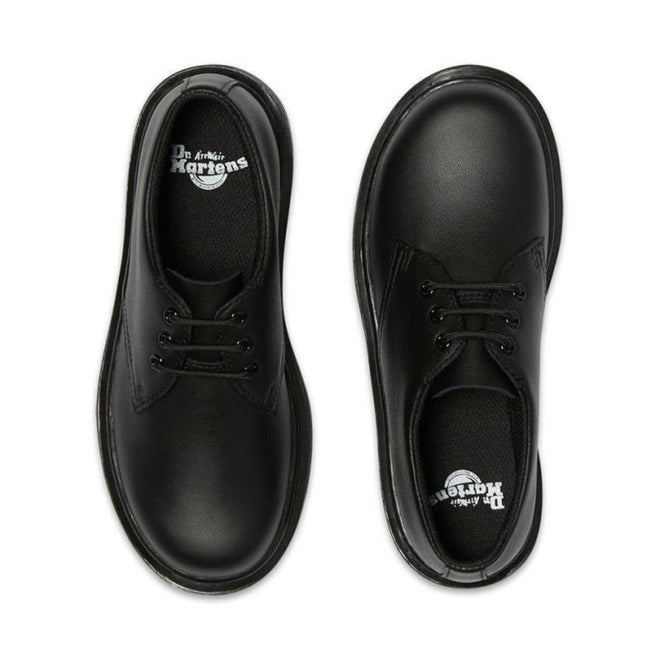 A pair of Dr Martens kids 1461 Mono J Lace Up School Shoes in black Softy T leather, viewed from above with visible brand logos on the insoles, are positioned parallel on a white background., 20644, 20645, 190665364316, 190665364217, 20648, 190665364231, 20650, 190665364255