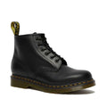 Image of right foot, side on of Dr Martens 101 6 Eye Yellow Stitching Boot Black, classic sole with the pull tab but only 6 eyelets so lower up the keg -Foot Forward Shoes