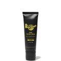 Image of right foot, side on of Dr Martens Polish Nourishing Shoe Creme Black Tube-Foot Forward Shoes