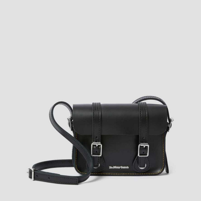Image of right foot, side on of Dr Martens Leather Cross Body Black Leather Satchel 7 inch-Foot Forward Shoes